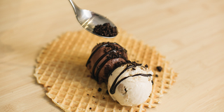 Illustration for article titled Ben and Jerry's new ice cream burrito is happiness in a waffle wrap